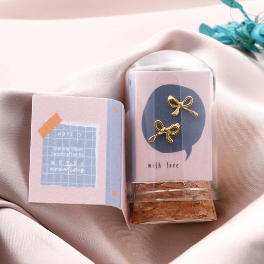 Attic Creations Little Note Curled Bow Earrings Gold