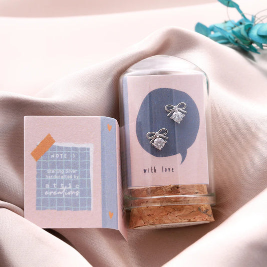 Attic Creations Little Note Bow And Crystal Heart Earrings Silver